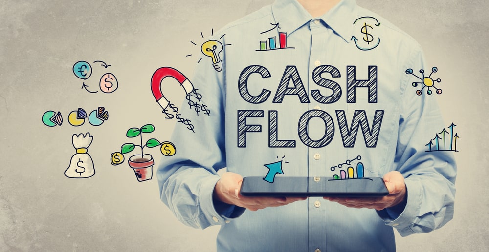 Cash Flow concept with young man holding a tablet computer - Image