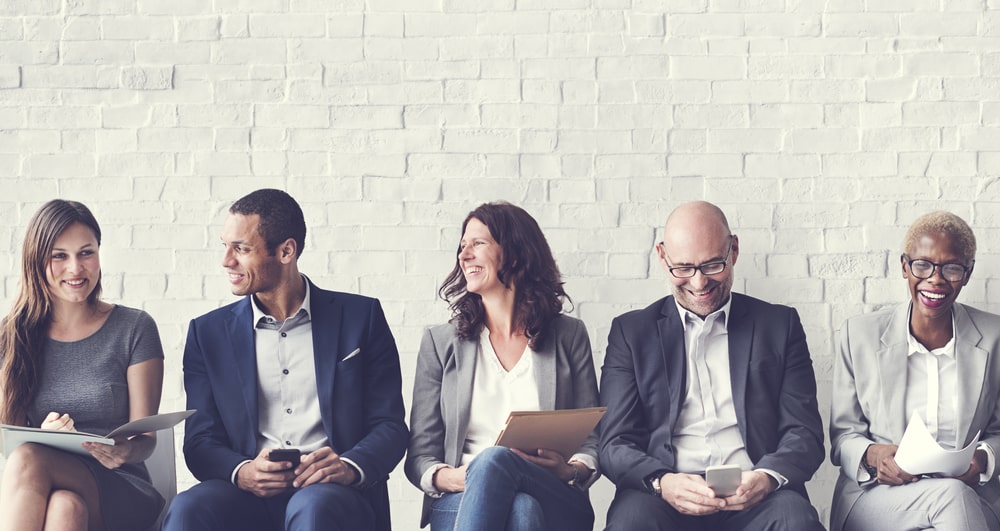 people waiting for an interview for a staffing company