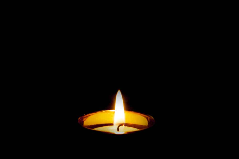 A single candle in the dark
